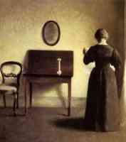 a lady reading in an interior