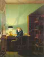 man reading by lamplight