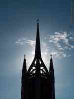 church spire sunlit from behind