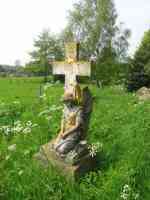 kneeling angel by cross