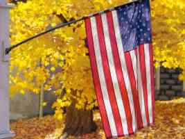 american flag in autumn