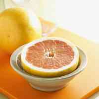 whole and halved grapefruit