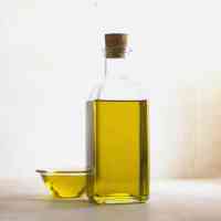 olive oil in bowl and bottle