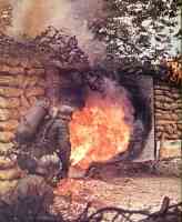 Flame thrower in action against an enemy dugout