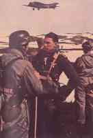 German paratroopers in conversation with an air force pilot