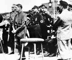 hitler addressing nazi units in 1933 with captains and brown shirt chiefs roehm and himmler