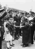 hitler handed a rose by a little girl at anhalter railway station berlin