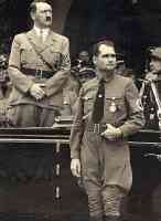 hitler standing in car next to rudolph hess