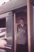 old hitler smiling on a train
