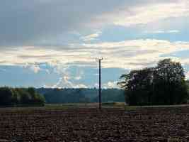 field telephone pole and strange clouds
