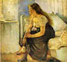woman sitting on bed