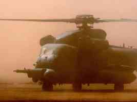 chopper landing in dust cloud