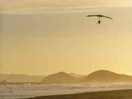 hang glider over the beach