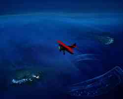 red biplane over the deep blue sea